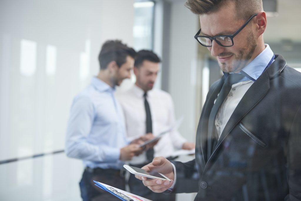 Man and his team behind the glass